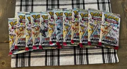 Pokemon TCG Prismatic Evolutions Booster Pack Lot Of (12) FACTORY SEALED PACKS - Image 1