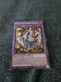 Yugioh Snake-Eyes Doomed Dragon 1st Edition Secret Rare - Image 1