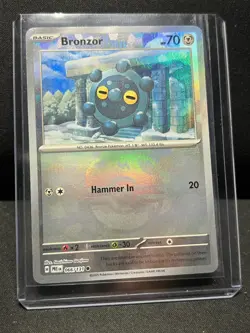 Bronzor 066/131 Reverse Holo Master Ball Pokemon Prismatic Evolutions NM - Image 1