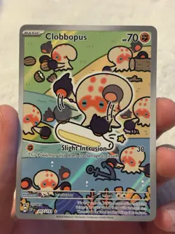 Clobbopus 207/191 IR Pokemon Illustration Rare Surging Sparks Trading Card - Image 1