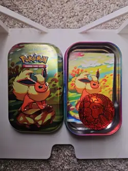 Flareon Prismatic Evolutions Mini Tin with Art Card and Coin Empty Tin - Image 1