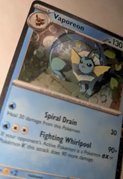 Vaporeon SVP 168 Black Star Promo TCG Pokemon Card Double Swirl Cosmos Holo - Image 2