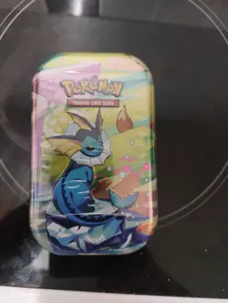 Pokemon TCG: Scarlet & Violet-Prismatic Evolutions Mini Tin - IN HAND - Vaporeon - Image 1