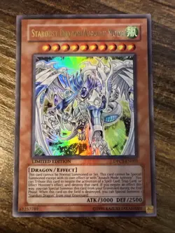 Yugioh Stardust Dragon/Assault Mode DPCT-EN003 Secret Rare Limited Edition LP - Image 1