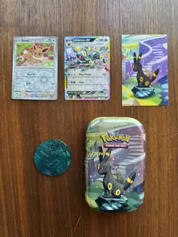 Prismatic Evolutions Umbreon tin + NM Holos & Promo Card & Coin - Image 1