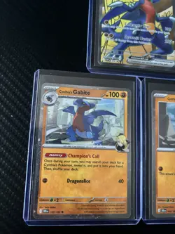 Pokemon TCG Cynthia’s Garchomp SVP 204 Black Star Promo Gible and Gabite. - Image 3