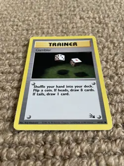 1999 Pokemon Unlimited Base Set Fossil Gambler Trainer Card Good Condition - Image 1