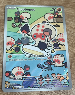 Clobbopus 207/191 Surging Sparks Illustration Rare Pokemon TCG Card - Image 1