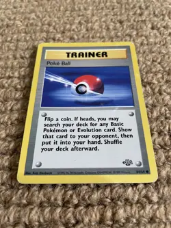 1999 Pokemon Unlimited Base Set Jungle Poke Ball Trainer Card Good Condition - Image 1