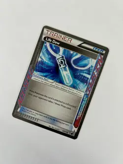 Life Dew - 107/116 - Holo - Plasma Storm - Pokemon Card - Image 1