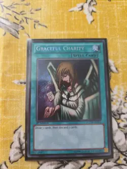Yu-Gi-Oh! TCG Graceful Charity Secret Rare 1st Edition LCYW-EN064 - Image 1