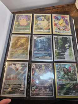 13.5 page binder of Holo/Foil Pokemon Cards - Image 1