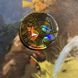 Raichu Pokemon TCG plastic kaleidoscope/shattered pattern coin - Image 1