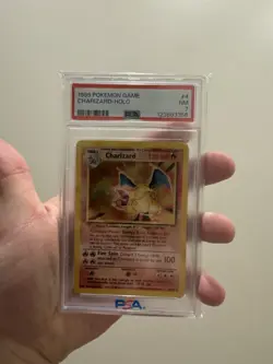 1999 POKEMON BASE SET UNLIMITED #4 CHARIZARD-HOLO PSA 7 - Image 1
