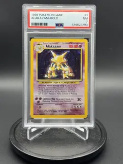 1999 POKEMON GAME BASE SET #1 ALAKAZAM HOLO SHADOWLESS PSA 7 NM CARD - Image 1