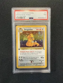 1999 Pokemon Fossil 1st Edition Dragonite Holo Card #4/62 PSA 7 - Image 1