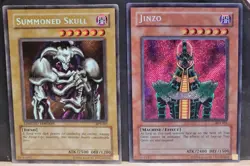 YUGIOH 2003 COLLECTOR'S TIN LOT of 2 Summoned Skull & Jinzo BPT 002 LP 011 LP+ - Image 1