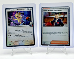 Team Rocket's Giovanni 174/182 & Meowth 149/182 Cosmos Holo Promo Set - MINT+ - Image 1