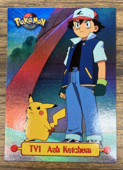 1999 Topps Pokemon Series 1 #TV1 Ash Ketchum Foil Blue logo - Image 1