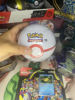Pokemon TCG premier Ball Tin Trading Card Game Contains 3 Booster Packs - Image 1