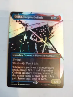 Ovika, Enigma Goliath (Showcase) Phyrexia: All Will Be One Foil - Image 1