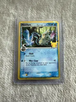 Pokemon Card Mimikyu SWSH136 Delta Species 25th Celebrations Black Star Promo - Image 1