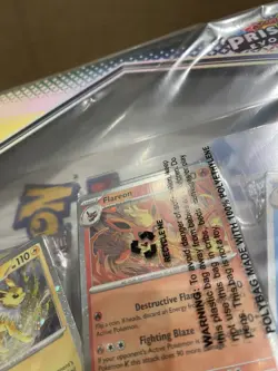 Pokemon TCG: Scarlet And Violet Prismatic Evolutions Poster Collection In Hand - Image 3