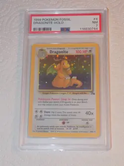 1999 POKEMON PSA 7 NM FOSSIL DRAGONITE HOLOFOIL #4 - Image 1