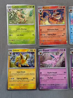 Pokemon Prismatic Evolutions Costco Mini Tin Cosmo Promos (8) Umbreon Sylveon - Image 2