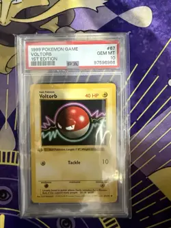 1999 POKEMON BASE SET 1ST EDITION #67 VOLTORB PSA 10 - Image 1