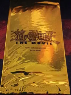 100 factory-sealed Yu-Gi-Oh! The Movie gold promo packs from 2004. - Image 2