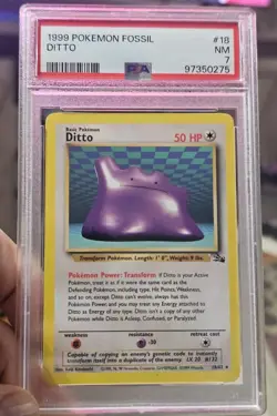 Ditto 18/62 Fossil Regular PSA 7 1999 Pokemon - Image 1