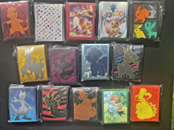 Lot of 14 Assorted Pokemon Sealed ETB Card Sleeves - Image 1