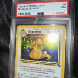 1999 POKEMON FOSSIL #4 DRAGONITE-HOLO PSA 7 - Image 1