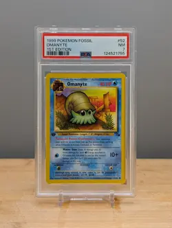 1999 Pokemon Fossil 1st Edition Omanyte #52 PSA 7 - Image 1