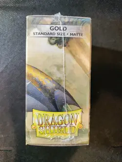 (100-Pack) Dragon Shield Standard Size Gaming Card Sleeves - GOLD MATTE - Image 4
