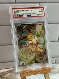 Pokemon TCG Eevee Prismatic Evolutions ETB Promo Card SVP 173 PSA 9 - Image 1