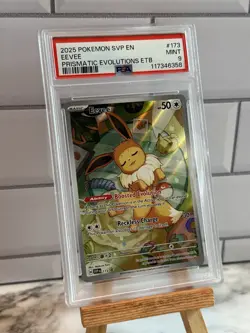 Pokemon TCG Eevee Prismatic Evolutions ETB Promo Card SVP 173 PSA 9 - Image 1