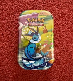 Pokemon TCG: Scarlet & Violet-Prismatic Evolutions Mini Tin - IN HAND - Vaporeon - Image 1