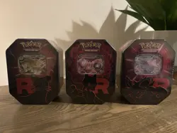 Pokemon TCG: Team Rocket Tin (Set of 3) IN HAND & SEALED - Image 1