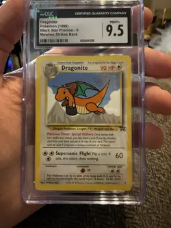 1999 Pokemon Dragonite Black Star Movie Promo 5 CGC 9.5 Minor Scratch - Image 1