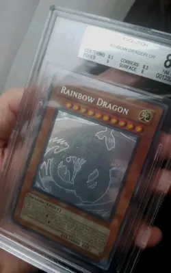 Yugioh Rainbow Dragon Ghost Rare Unlimited TAEV-EN006 BGS 8.5 - Image 1