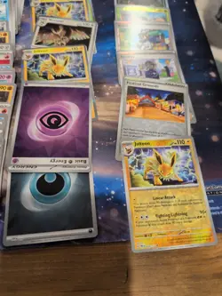Lot Of 184 Pokemon Cards, Surging Sparks, Prismatic Evolutions - Image 2