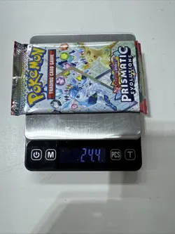 Pokemon Prismatic Evolutions Booster Pack -HEAVY 24.4g- Possible Demi/God Pack! - Image 1