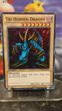 TRI-HORNED DRAGON 1st Edition YU-GI-OH Holo Foil Trading Card LCYW-EN157 - Image 1