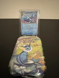 Pokemon Costco Prismatic Evolutions TCG Mini Tin Sealed + Vaporeon Foil Card - Image 1