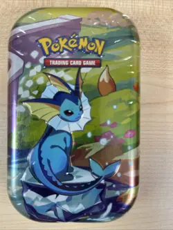 VAPOREON Mini Tin Pokemon Prismatic Evolutions Scarlet & Violet TCG Sealed - Image 1