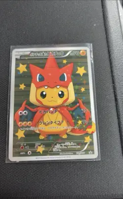 2016 Pokemon JPN XY Promo Poncho Wearing Pikachu M Charizard Y #208 Not Graded - Image 1