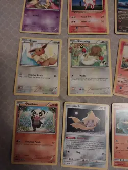 9 pokemon cards lot- solrock, jirachi, pancham, charmander, fletchling, eevee - Image 2