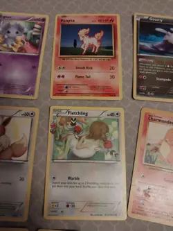 9 pokemon cards lot- solrock, jirachi, pancham, charmander, fletchling, eevee - Image 5